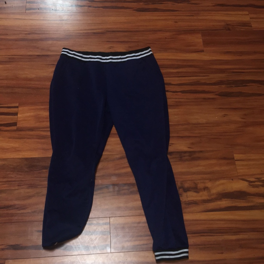 Blue sweatpants with black and white strip lining